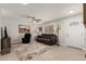 Cozy living room featuring a comfortable sofa, area rug, and plenty of natural light at 10702 W Salem Dr, Sun City, AZ 85351