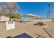 Community pavilion with picnic table and outdoor grill for resident enjoyment at 10702 W Salem Dr, Sun City, AZ 85351