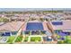 Aerial view of a home with solar panels and a landscaped backyard with covered patio in a suburban neighborhood at 10715 E Thornton Ave, Mesa, AZ 85212