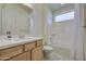 Bright bathroom featuring a shower-tub combo, a white vanity, and tile floors at 10715 E Thornton Ave, Mesa, AZ 85212