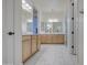 Bright bathroom with double vanity, modern lighting, and walk-in shower at 10715 E Thornton Ave, Mesa, AZ 85212