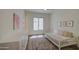 Cozy bedroom with a daybed, decorative rug, and natural light from the window at 10715 E Thornton Ave, Mesa, AZ 85212