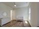 Bright Bedroom with a crib, changing table, and natural light from a window at 10715 E Thornton Ave, Mesa, AZ 85212