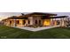 Beautiful clubhouse with stone accents, covered seating, and lush landscaping at dusk at 10715 E Thornton Ave, Mesa, AZ 85212