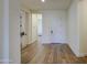 Bright entryway features hardwood floors, neutral walls, and an open floor plan with modern finishes at 10715 E Thornton Ave, Mesa, AZ 85212
