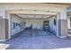 A spacious three car garage with epoxy floors, finished walls, and storage racks at 10715 E Thornton Ave, Mesa, AZ 85212