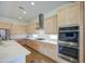 Contemporary kitchen boasting modern appliances, sleek countertops, and custom cabinets at 10715 E Thornton Ave, Mesa, AZ 85212