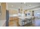 Bright open kitchen with island, stainless appliances and breakfast area at 10715 E Thornton Ave, Mesa, AZ 85212