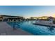 Large community pool with a relaxing poolside area and ample seating at 10715 E Thornton Ave, Mesa, AZ 85212