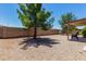 Backyard with gravel, wall and a covered patio at 11523 E Lindner Ave, Mesa, AZ 85209