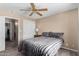 Bedroom with carpet, ceiling fan and a closet at 11523 E Lindner Ave, Mesa, AZ 85209