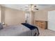 Bedroom featuring a decorative ceiling fan and a chest of drawers at 11523 E Lindner Ave, Mesa, AZ 85209