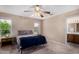 Cozy bedroom with plush carpeting and natural light at 11523 E Lindner Ave, Mesa, AZ 85209