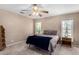 Relaxing bedroom with soft natural light from dual windows at 11523 E Lindner Ave, Mesa, AZ 85209