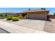 Charming single story home features desert landscaping and a spacious two-car garage at 11523 E Lindner Ave, Mesa, AZ 85209