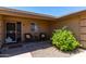 Inviting front porch features seating area perfect for enjoying a morning coffee at 11523 E Lindner Ave, Mesa, AZ 85209