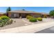 Charming single story home features desert landscaping and a quaint front patio at 11523 E Lindner Ave, Mesa, AZ 85209