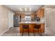 Kitchen island with seating and stainless steel appliances at 11523 E Lindner Ave, Mesa, AZ 85209