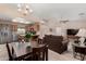 Open floorplan featuring a kitchen with stainless steel appliances and a cozy living room at 11523 E Lindner Ave, Mesa, AZ 85209