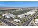 Aerial view of shopping centers and commercial buildings featuring a large parking lot and adjacent streets at 1231 E Sunburst Ln, Tempe, AZ 85284