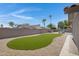 Sprawling backyard featuring artificial turf and desert landscaping, offering a low-maintenance outdoor space at 1231 E Sunburst Ln, Tempe, AZ 85284