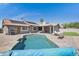 Inviting backyard featuring a private pool, lush landscaping, and covered patio, perfect for outdoor entertaining at 1231 E Sunburst Ln, Tempe, AZ 85284
