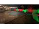 Inviting backyard pool features an outdoor lounge area and festive red and green holiday lighting at 1231 E Sunburst Ln, Tempe, AZ 85284