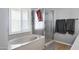 The bathroom has a bathtub and shower with tiled flooring at 1231 E Sunburst Ln, Tempe, AZ 85284