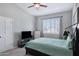 This bedroom offers bright light, gray walls, and plenty of closet space at 1231 E Sunburst Ln, Tempe, AZ 85284