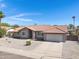 Inviting single-Gathering home with a tidy front yard, featuring desert landscaping and a two-car garage at 1231 E Sunburst Ln, Tempe, AZ 85284