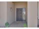 Inviting entryway featuring a decorative steel security screen door and sidelight at 1231 E Sunburst Ln, Tempe, AZ 85284