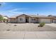 Charming single-story home featuring a tile roof, desert landscaping, and an attached two-car garage at 1231 E Sunburst Ln, Tempe, AZ 85284