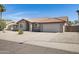 Single-story home featuring a desert landscape, neutral exterior, and tile roof at 1231 E Sunburst Ln, Tempe, AZ 85284