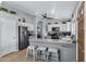 Spacious kitchen features stainless steel appliances, breakfast bar, and lots of natural light at 1231 E Sunburst Ln, Tempe, AZ 85284