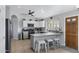 Open concept kitchen with granite countertops, stainless steel appliances, and a breakfast bar at 1231 E Sunburst Ln, Tempe, AZ 85284