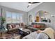 Inviting living room with vaulted ceilings, two comfortable sofas, and a colorful area rug at 1231 E Sunburst Ln, Tempe, AZ 85284