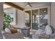 Cozy outdoor living space on the patio with comfortable seating, a ceiling fan, and ample natural light at 1231 E Sunburst Ln, Tempe, AZ 85284