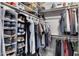 Well-organized walk-in closet with ample storage for clothing, shoes, and accessories at 1231 E Sunburst Ln, Tempe, AZ 85284