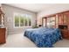 Cozy bedroom with natural light, carpet floors and ample storage at 12325 S 179Th Ave # 29, Goodyear, AZ 85338