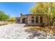 Beautiful home featuring desert landscaping, arched windows, and a tiled roof at 12325 S 179Th Ave # 29, Goodyear, AZ 85338