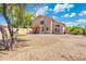 Large backyard with covered patio, gravel, and privacy fencing at 1254 W Browning Way, Chandler, AZ 85286