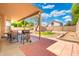 Backyard features covered patio, BBQ, and decorative gravel at 1254 W Browning Way, Chandler, AZ 85286