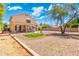 Backyard with covered patio, seating, and low-maintenance landscaping at 1254 W Browning Way, Chandler, AZ 85286