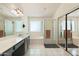 Bright bathroom with a double sink vanity, walk-in shower, and separate tub offers a relaxing retreat at 1254 W Browning Way, Chandler, AZ 85286