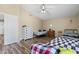 This bedroom features hardwood floors, white trim and neutral paint at 1254 W Browning Way, Chandler, AZ 85286