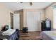 Bedroom featuring wood floors, closet, and neutral wall paint at 1254 W Browning Way, Chandler, AZ 85286