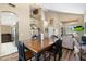 Open-concept dining area with a chandelier, wood floors, and seamless flow to other living spaces at 1254 W Browning Way, Chandler, AZ 85286