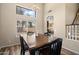 Dining room featuring a hanging light fixture and views of the backyard through large windows at 1254 W Browning Way, Chandler, AZ 85286