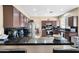 Bright kitchen with dark cabinetry and black countertop, offering seating at 1254 W Browning Way, Chandler, AZ 85286