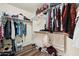 This walk-in closet offers ample storage space with shelves and hanging racks for organization at 1254 W Browning Way, Chandler, AZ 85286